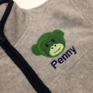 Adorable monkey face machine appliqué design with embroidered details