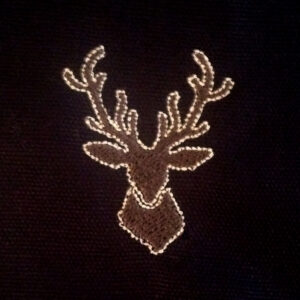 Deer head machine applique and filled embroidery design in several sizes.