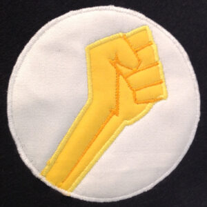 Fight the power! Powerful fist pump applique design – a sign of rebellion, power and protest.  Clenched fist as a revolutionary symbol
