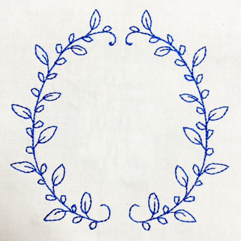 Floral geometric wreath with single initial Machine Embroidery Geek