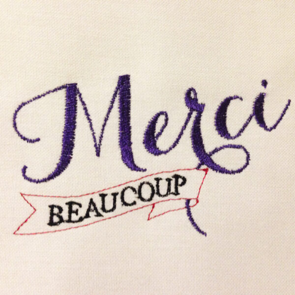 Elegant and whimsical merci beaucoup machine embroidery design in several sizes – a clever way to say thank you.