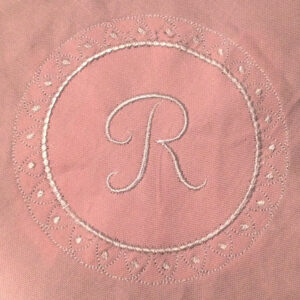 Single initial monogram embroidery design surrounded with decorative wreath.   Delicate monogram embroidery design in two sizes