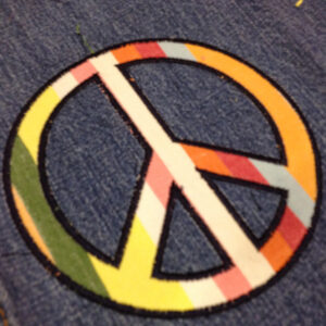 Simple and versatile appliqué and filled embroidery peace signs
