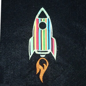 Blast off into space with this cute rocketship machine embroidery and applique design in four sizes.