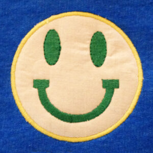 Fun smiley face machine appliqué design in several sizes. This happy face will make you smile.