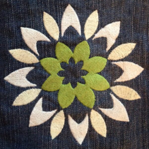 Modern, abstract and bold flower machine embroidery design inspired by a graphic in Thailand. In 2 sizes