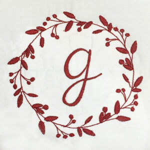 Whimsical wreath with flowers and berries machine embroidery design.  Perfect for adding an initial or a monogram.  4 sizes.