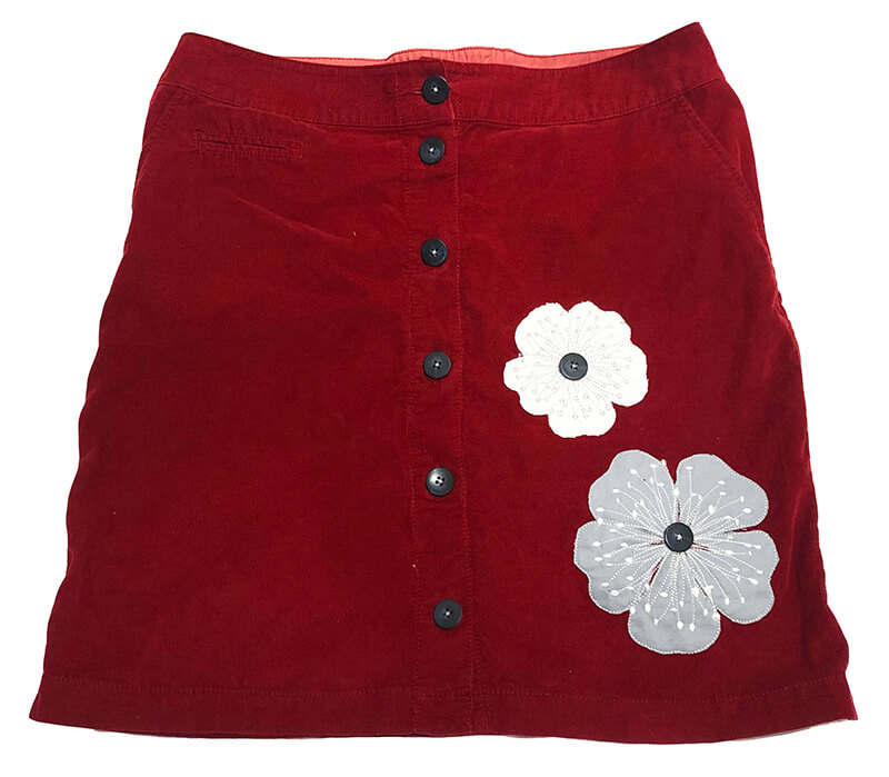 one of the best machine embroidery projects for beginners: appliqué on an old corduroy skirt