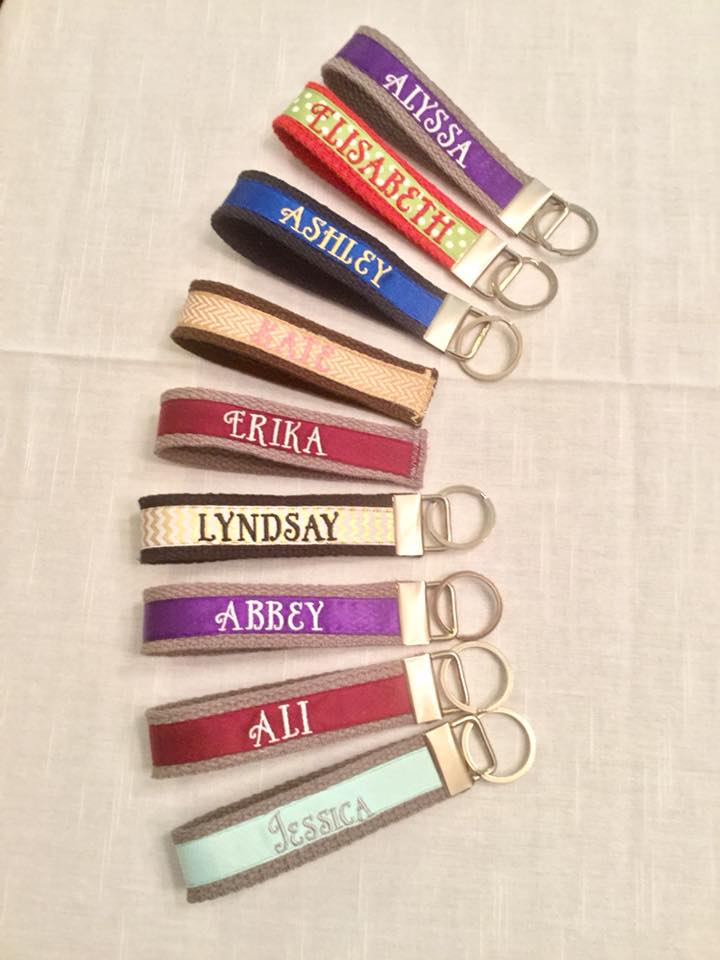 key fobs with names embroidered on ribbon