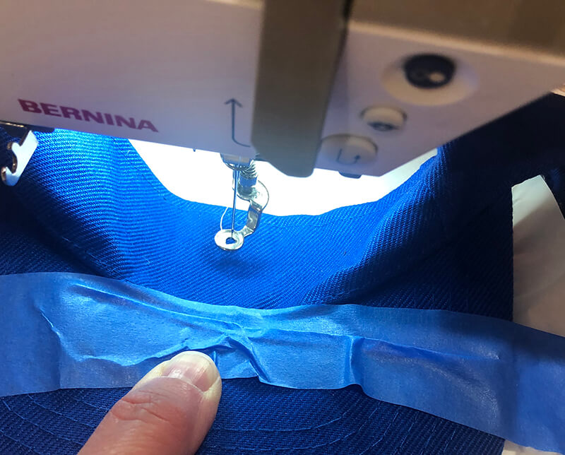 how to embroider on a visor: placing visor on hooped stabilizer