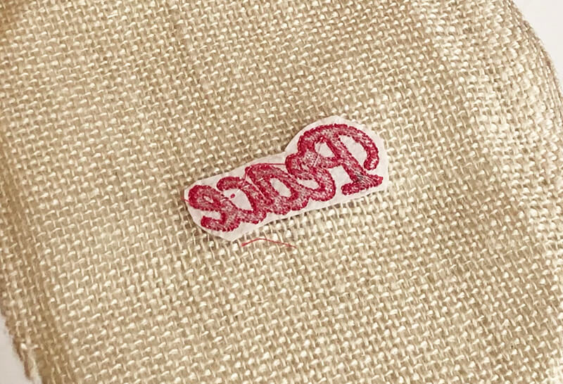 Back side of embroidered burlap