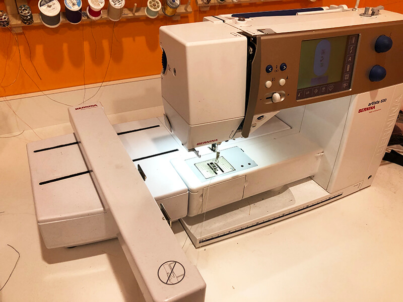 combination sewing / embroidery machine with embroidery module attached