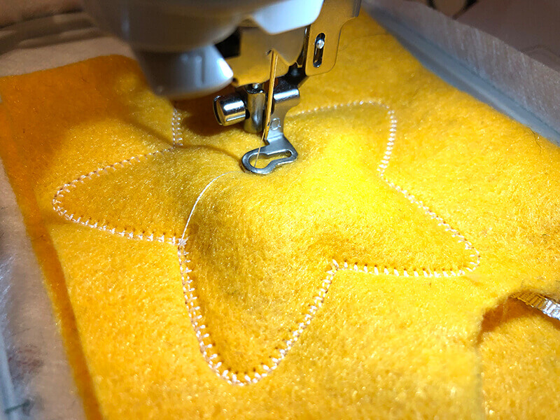 final stitching for in-the-hoop stuffie ornament