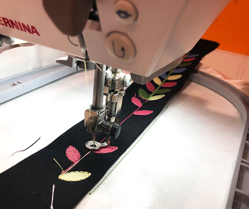 stitching repeated pattern to make an embroidered belt