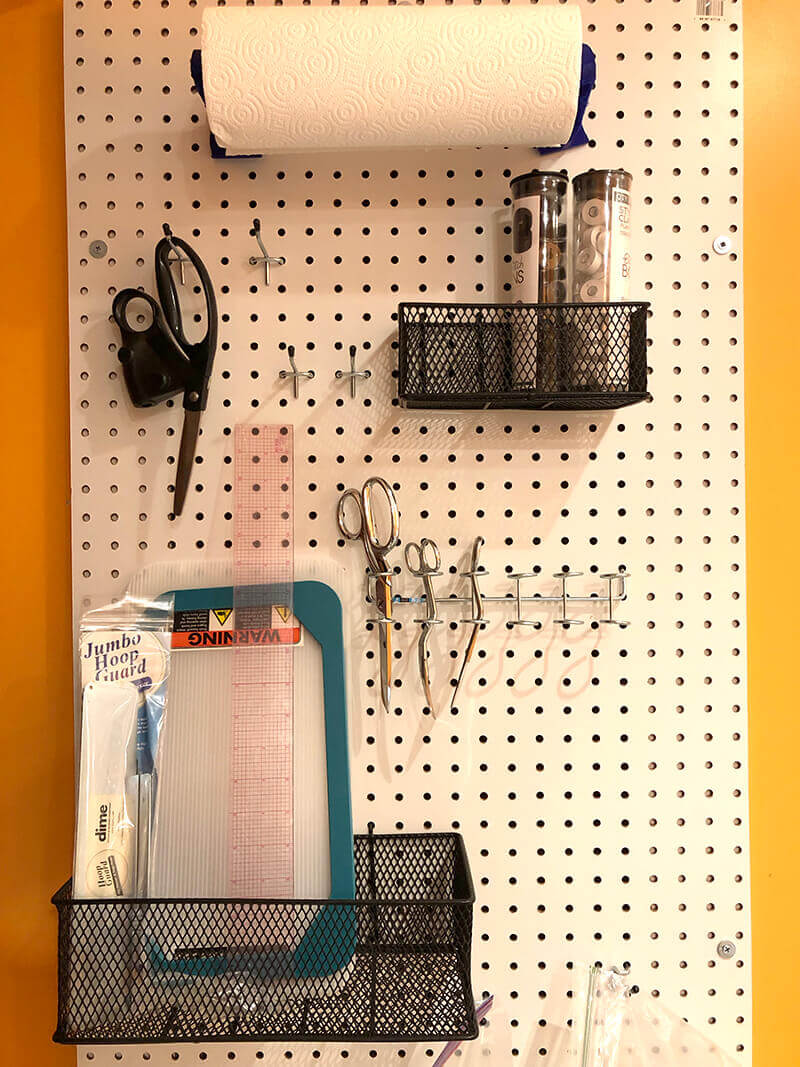 peg board for organizing sewing and embroidery tools