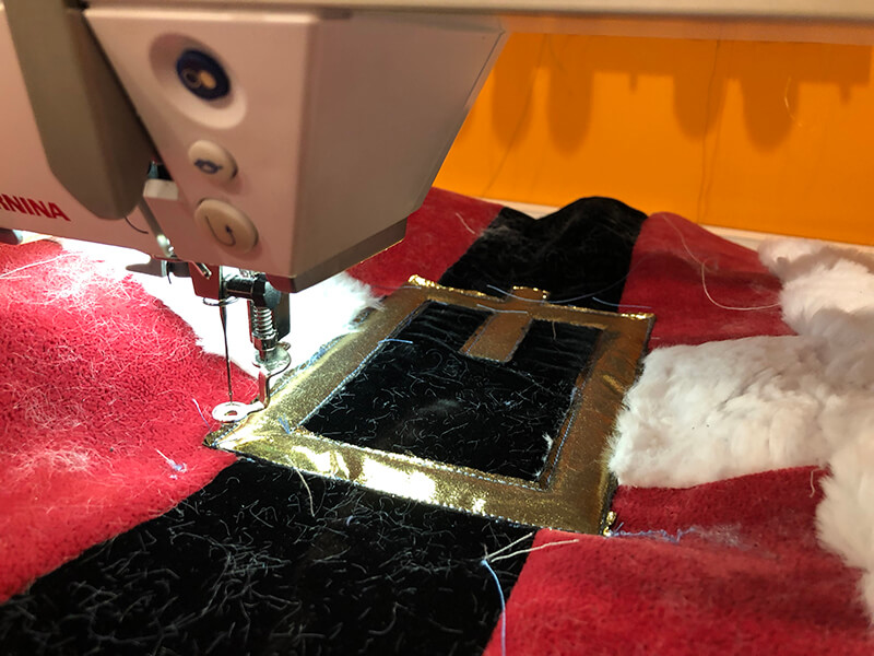 santa pillow - final satin stitching on belt buckle