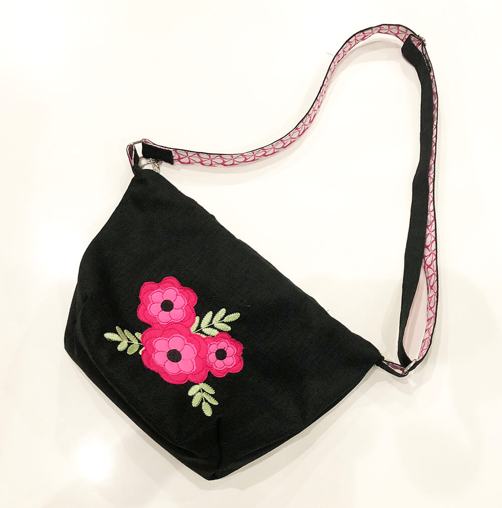 Boho purse with flower appliqué