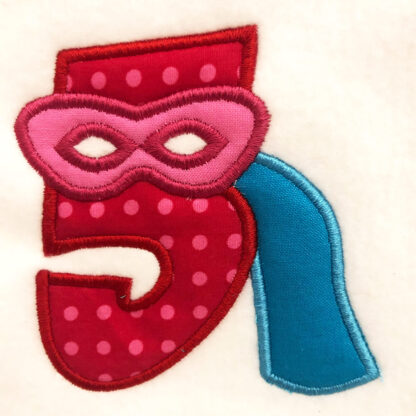 number applique with cape and mask