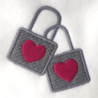 Interlocking locks with hearts appliqué design