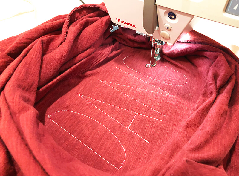 Placement stitching for couching design