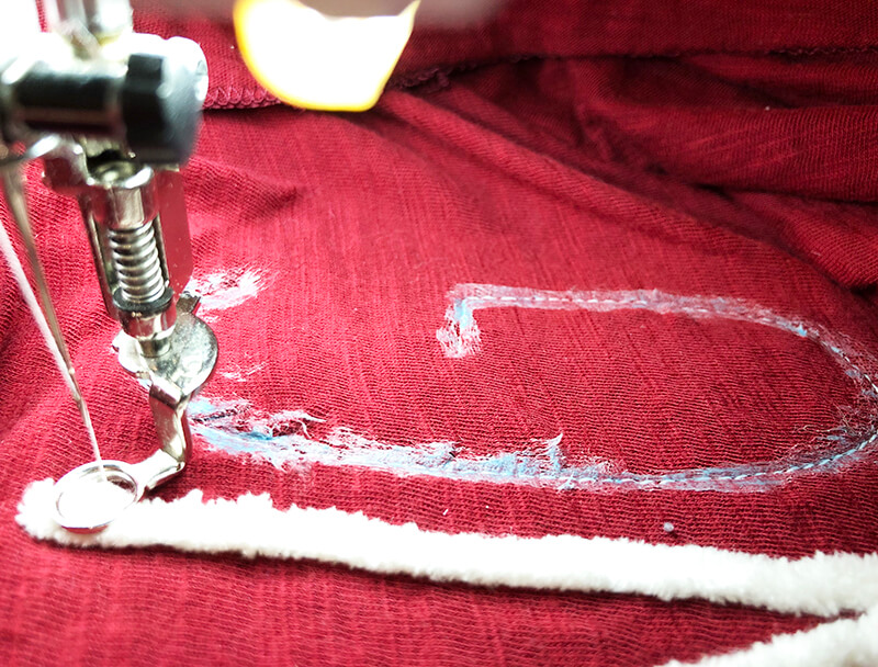 stitch one letter at a time when couching on an embroidery machine
