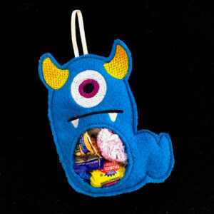 In-the-hoop two horned monster treat bag with window