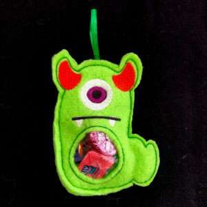 In-the-hoop two horned monster treat bag with window