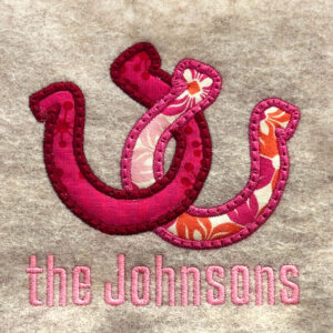 Interlocking horseshoes appliqué design